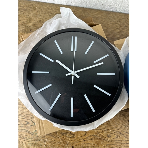 231 - Two As New and Boxed Contemporary Wall Clocks