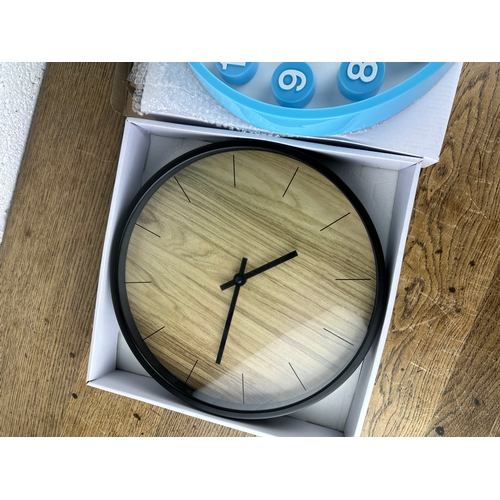 232 - Two As New and Boxed Contemporary Wall Clocks