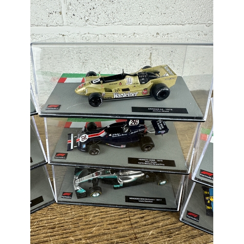 211 - 10 Panini 1:43 Scale Formula 1 Cars From Different Decades  - Lot 8 of 10