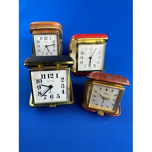 322 - Four Vintage Travel Alarm Clocks including Angelus