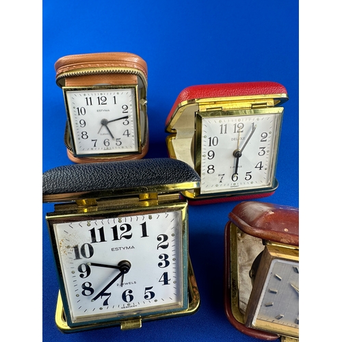 322 - Four Vintage Travel Alarm Clocks including Angelus