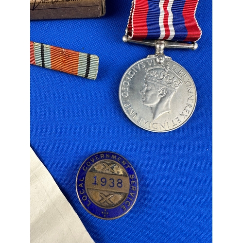 75 - WWII Medal & 1938 Local Government Service Cap Badge