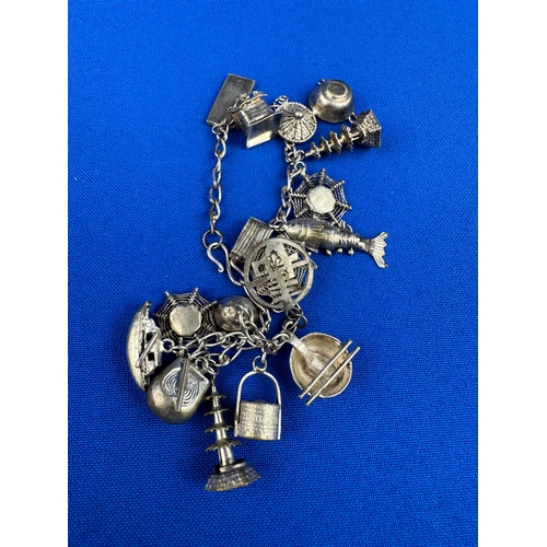 56 - Silver Charm Bracelet 14.2g