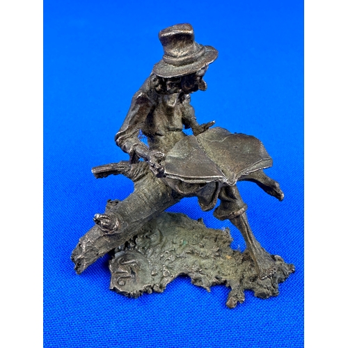 291 - Vintage Spelter Figure of a Cowboy with a Newspaper, Initial & Number to base