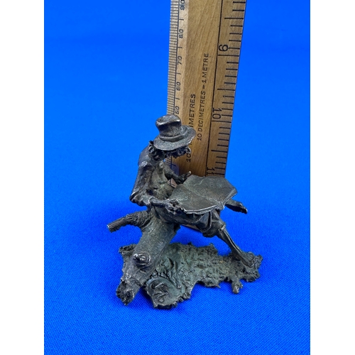 291 - Vintage Spelter Figure of a Cowboy with a Newspaper, Initial & Number to base