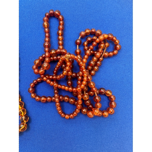 9 - 2 Strings of Amber Beads. Length 36” and 22”. Gross Weight 44.7g....