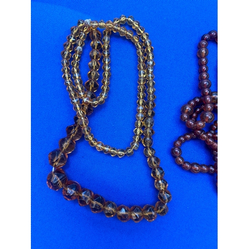 9 - 2 Strings of Amber Beads. Length 36” and 22”. Gross Weight 44.7g....