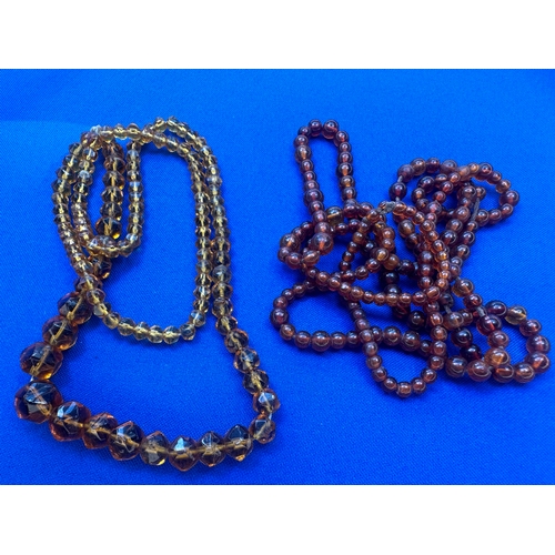 9 - 2 Strings of Amber Beads. Length 36” and 22”. Gross Weight 44.7g....