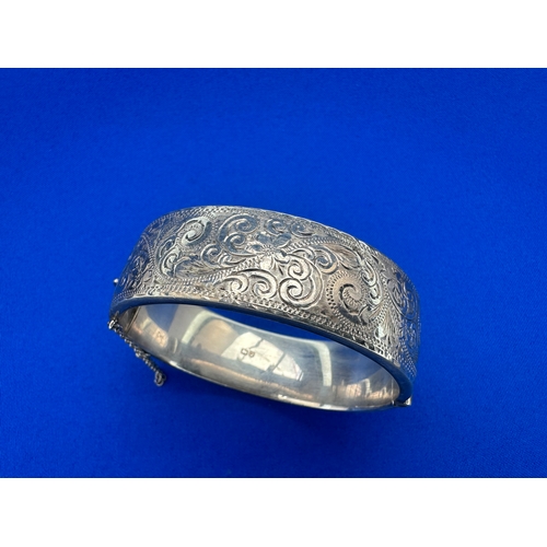 48 - Engraved Silver Bangle by Smith and Pepper, Chester 1959. Weight 26.5g...