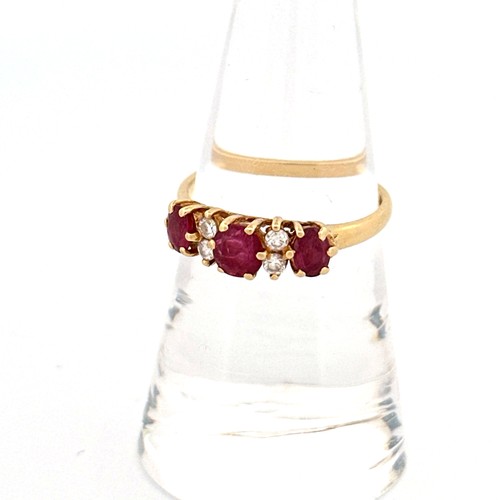 53 - 18ct Gold, Ruby & Diamond Ring - Three Oval Rubies, centre 4.9x4.0mm, outer stones 4.5x3.0mm. Four D... 