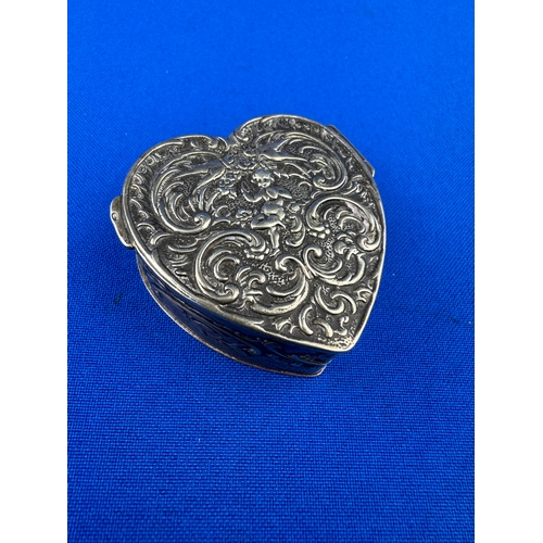 25 - Ornate 800 Silver Trinket / Pill Box with Repousse Decoration Depicting Putti & Swallows 37g