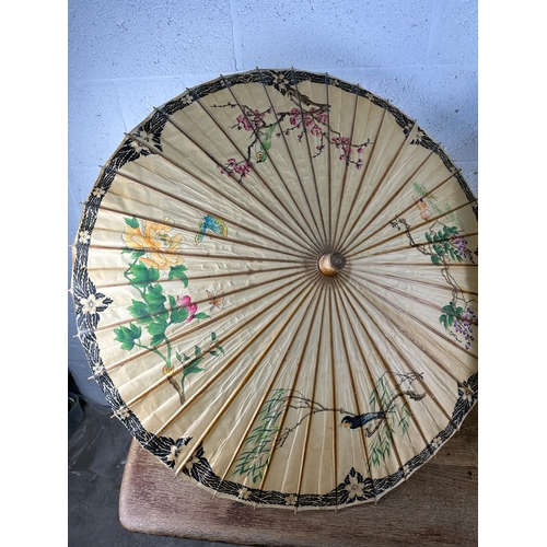 233 - Two Oriental Hand Painted Rice Paper Parasols