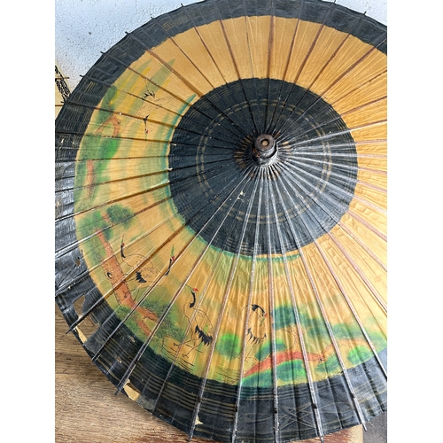 233 - Two Oriental Hand Painted Rice Paper Parasols