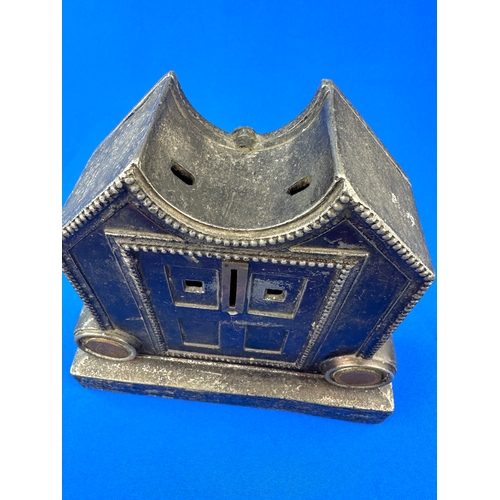 191 - Heavy Cast Iron Money Box with Coins affixed