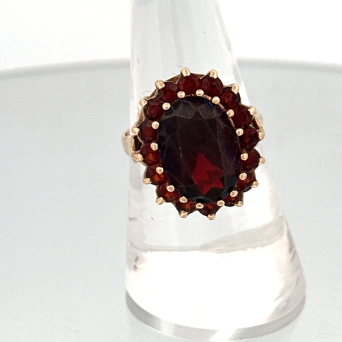 54 - 9ct Gold Ring Set with Garnets size Q 5.82g