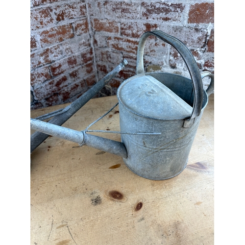 254 - Two Galvanised Vintage Watering Cans