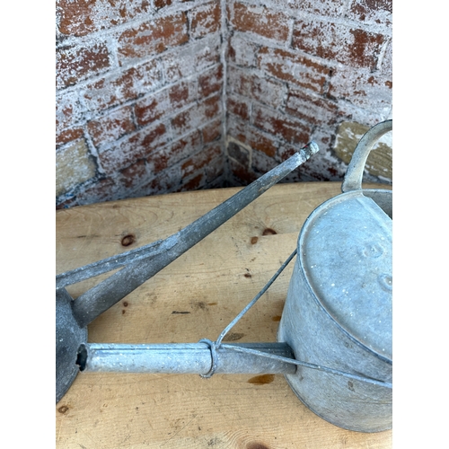 254 - Two Galvanised Vintage Watering Cans