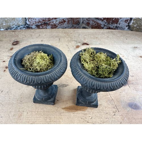 271 - Two Miniature Cast Iron Urns