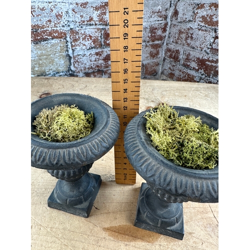 271 - Two Miniature Cast Iron Urns