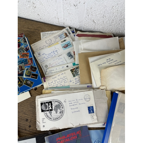 48 - Many Philatelic Items From Post Cards, Loose Stamps, Mint Stamps, Stamp Albums and Folders Arranged ... 