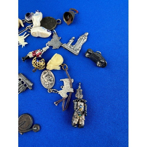 33 - Assorted Old Charms including some Silver