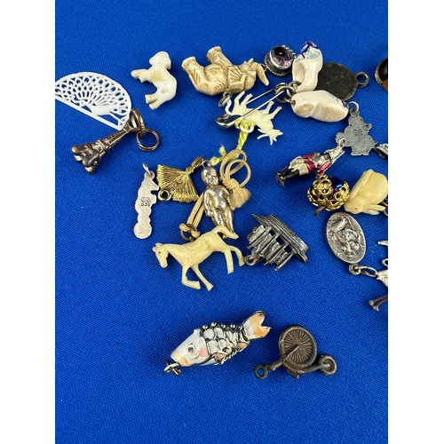 33 - Assorted Old Charms including some Silver