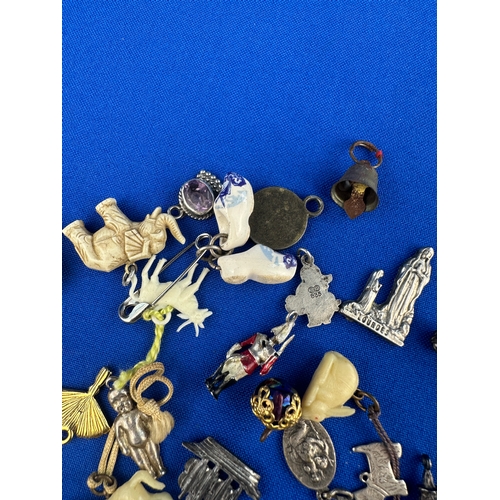 33 - Assorted Old Charms including some Silver