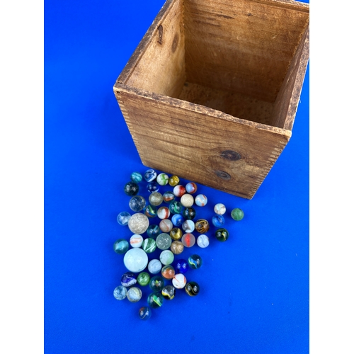 131 - Small Quantity of Vintage Marbles in Wooden Box