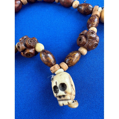 16 - Carved Wooden Bead & Vegetable Ivory Skull Bracelet
