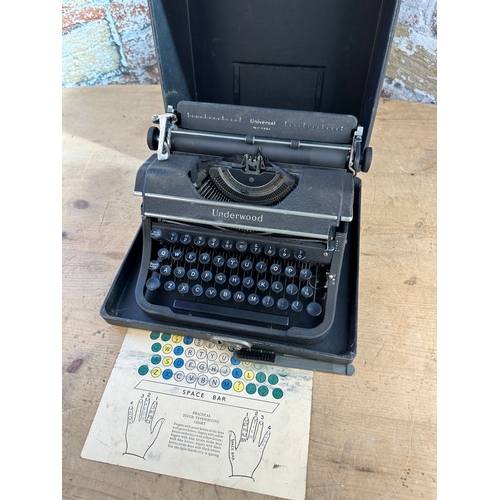 486 - Universal Underwood Typewriter in good condition with original brush & Card