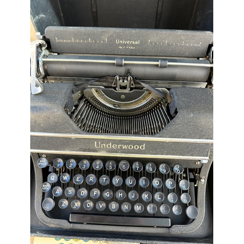 486 - Universal Underwood Typewriter in good condition with original brush & Card