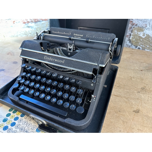 486 - Universal Underwood Typewriter in good condition with original brush & Card