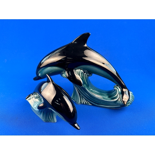 551 - Two Poole Pottery Dolphin Figures