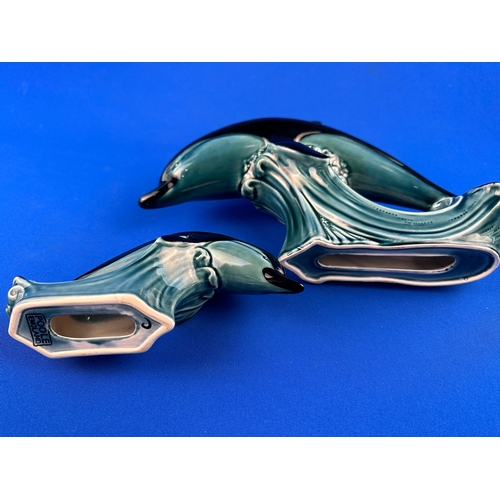 551 - Two Poole Pottery Dolphin Figures