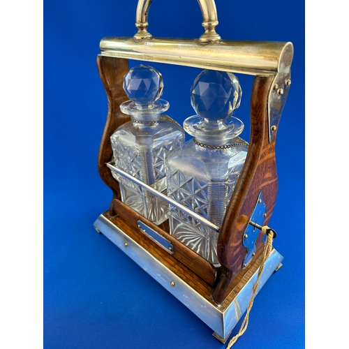 328 - Vintage Oak Tantalus with Key - Working. Two Decanters with Hallmarked Silver Labels