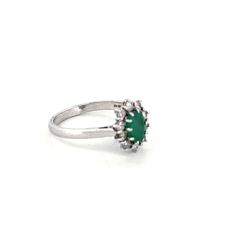 80 - Eighteen Carat White Gold, Emerald & Diamond Ring, London 1976. Size O. 3.6g