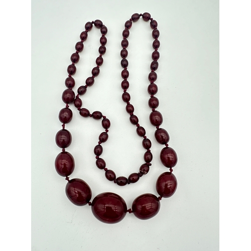 33 - Cherry Amber Bakelite Graduated Bead Necklace - 53.5g - approximately 85cm Long