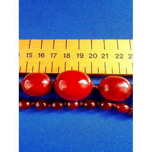 33 - Cherry Amber Bakelite Graduated Bead Necklace - 53.5g - approximately 85cm Long