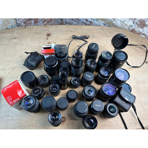 753 - Large Collection of SLR Lenses inc. Canon, Konica, Vivitar, Sigma, Olympus etc.