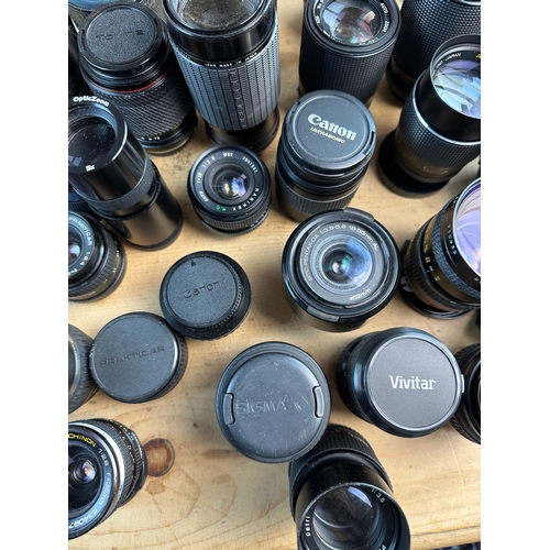 753 - Large Collection of SLR Lenses inc. Canon, Konica, Vivitar, Sigma, Olympus etc.