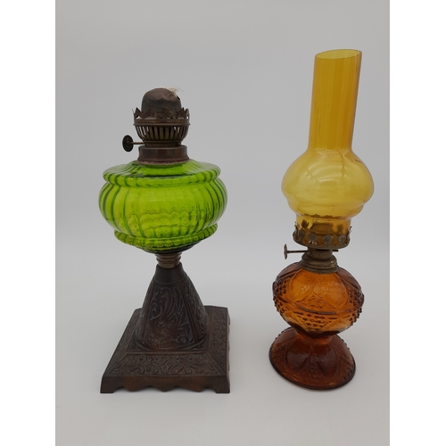 940 - Two Coloured Glass Oil Lamps - one missing chimney