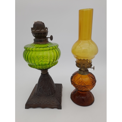 940 - Two Coloured Glass Oil Lamps - one missing chimney