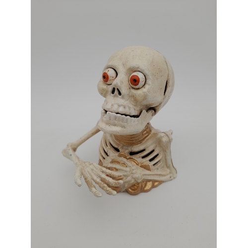 479 - Mechanical Cast Iron Skeleton Money Bank - 17cm tall