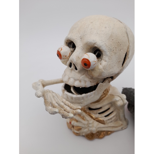 479 - Mechanical Cast Iron Skeleton Money Bank - 17cm tall