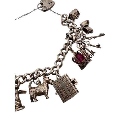 38 - Hallmarked Silver Charm Bracelet 63.25g...