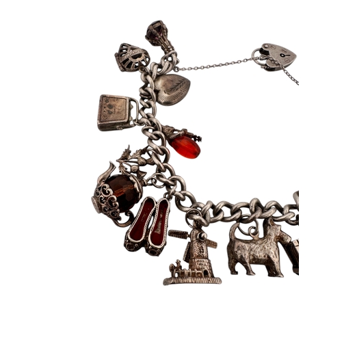 38 - Hallmarked Silver Charm Bracelet 63.25g...