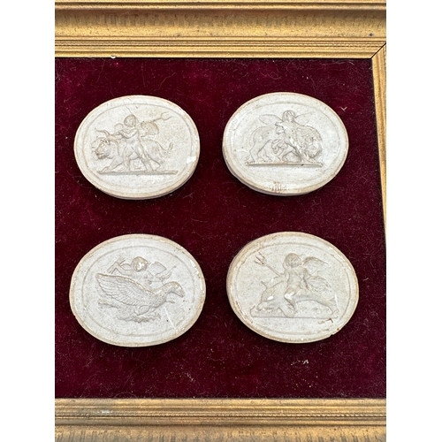 312 - Framed set of Four Plaster Intaglios