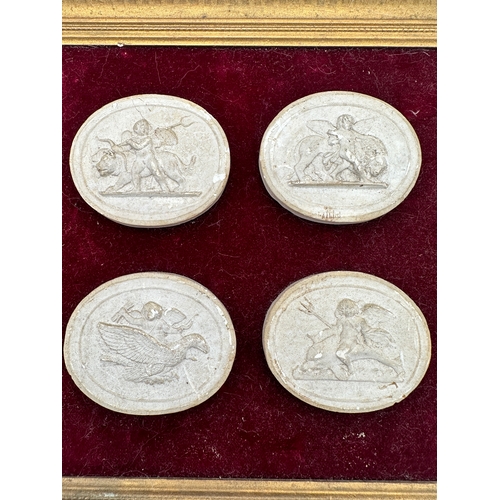 312 - Framed set of Four Plaster Intaglios