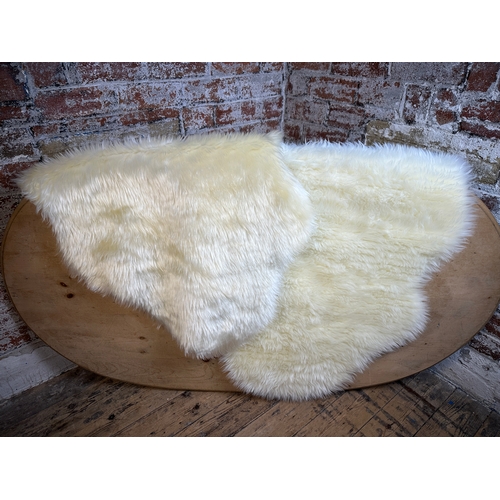 688 - Two As New 5ft Faux Sheepskin Rugs...