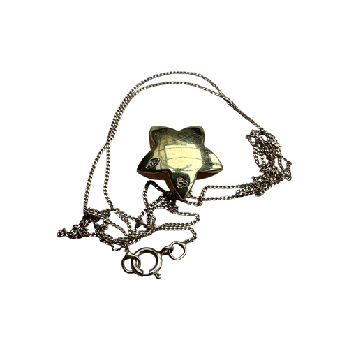 61 - NIne Carat Gold Star Pendant Necklace on 18